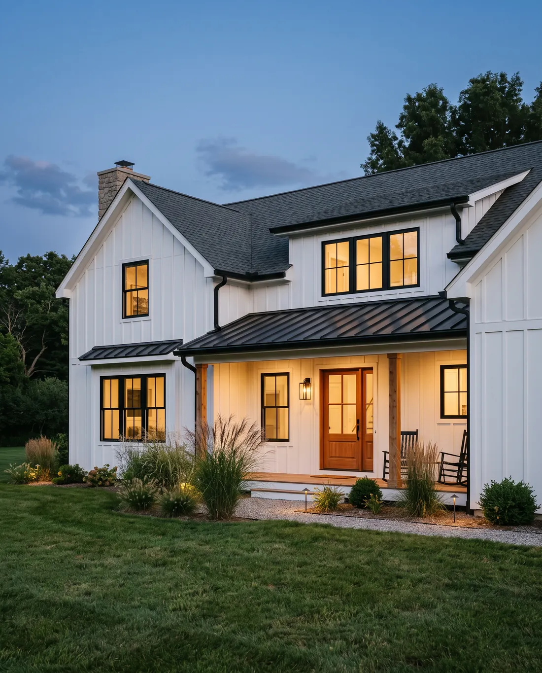 A farmhouse with new board and batten siding at dusk